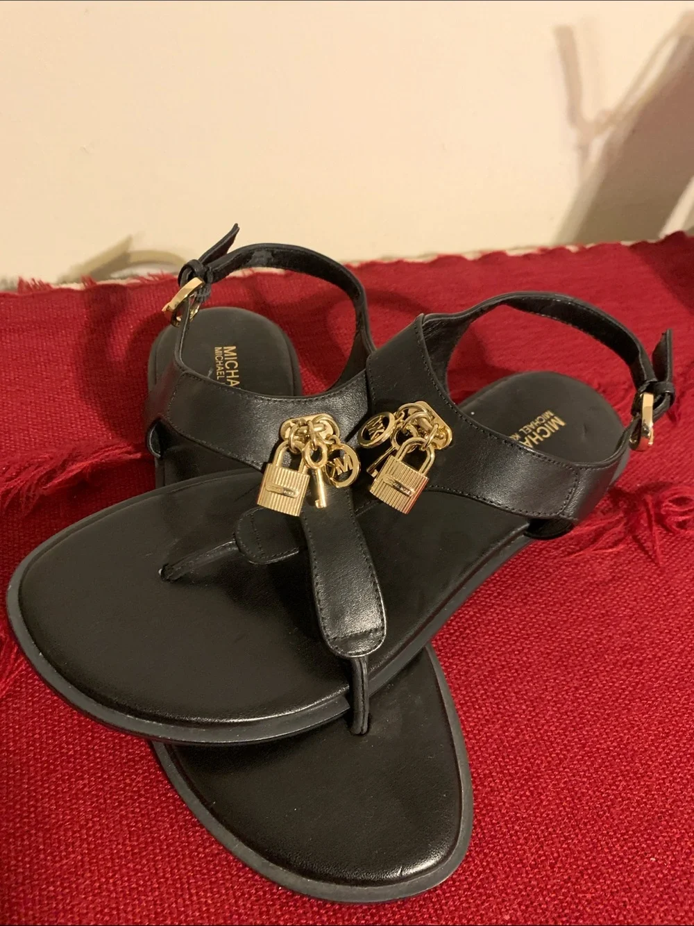 Michael Kors Black Leather Thong Sandals with Gold Padlock Charms